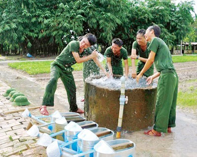 Soldiers gather by water well